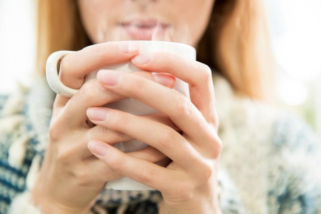 Lady drinking hot water